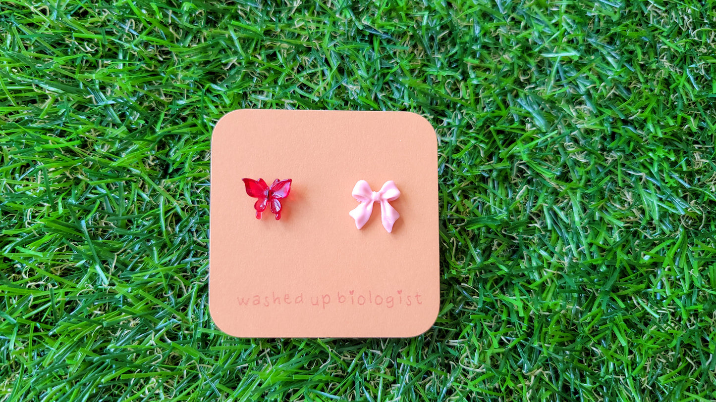 mismatched red butterfly and pink bow hypoallergenic stud earrings
