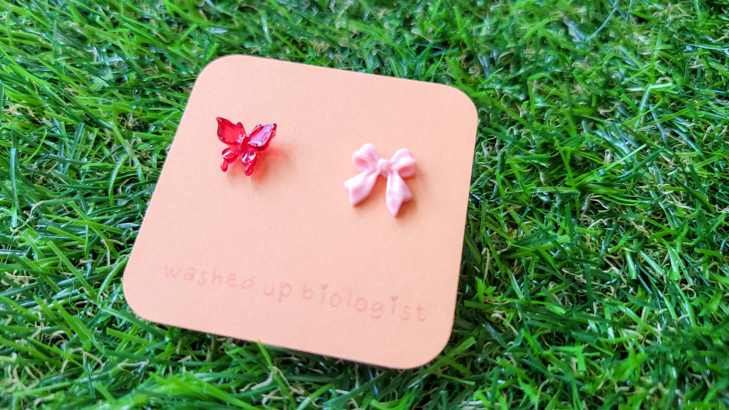 mismatched red butterfly and pink bow hypoallergenic stud earrings