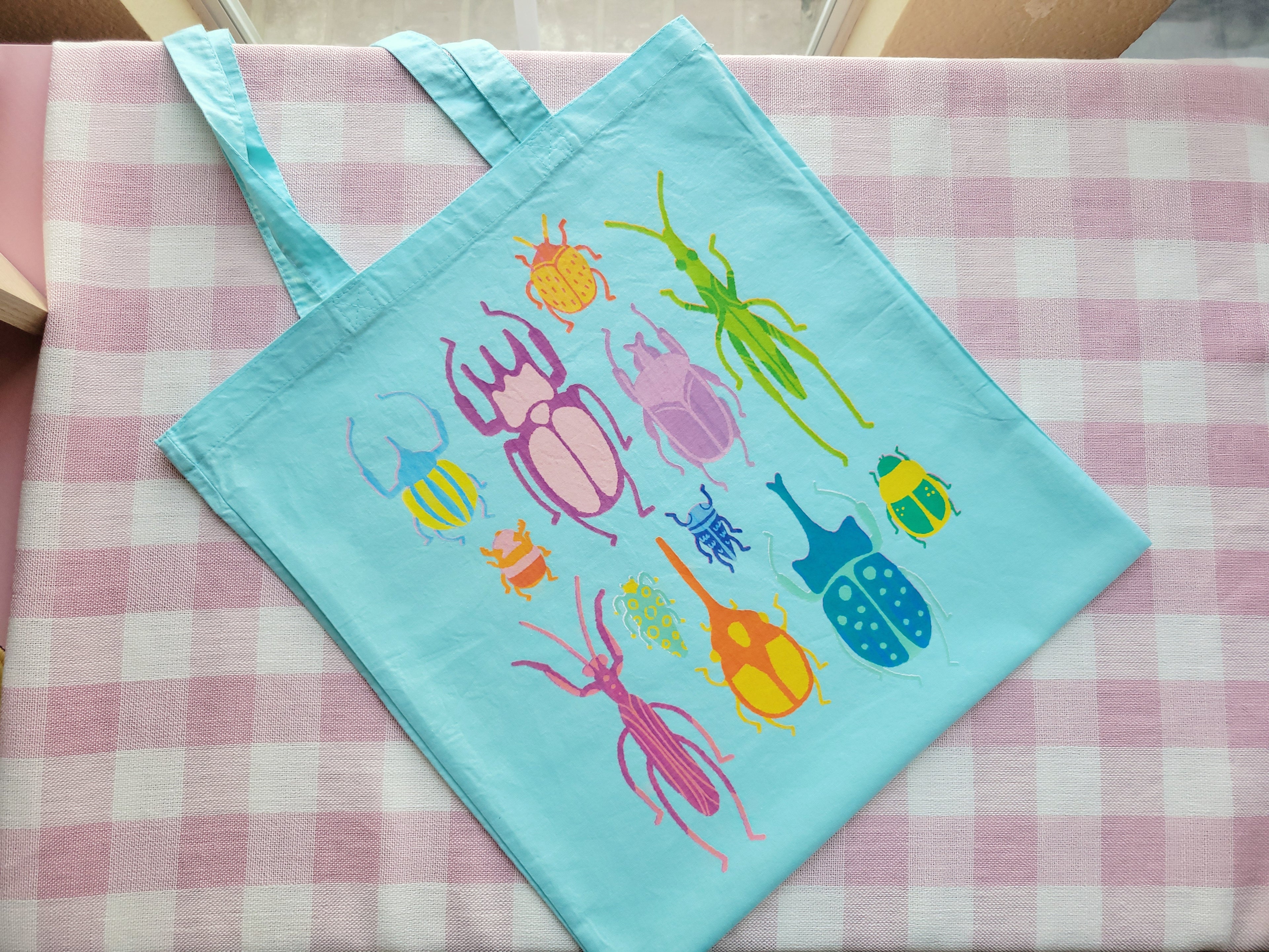 bright bugs light blue lightweight tote bag heat pressed