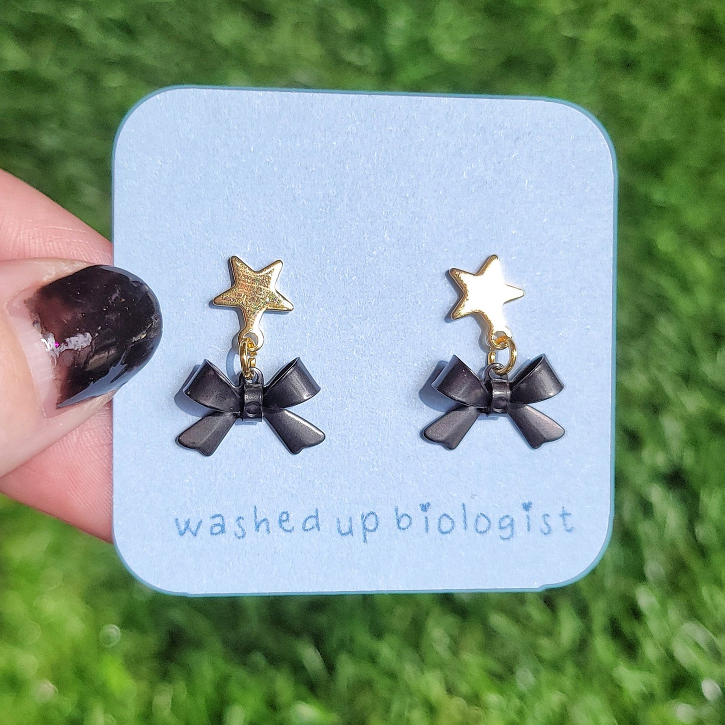 black bow dangly star stud earrings