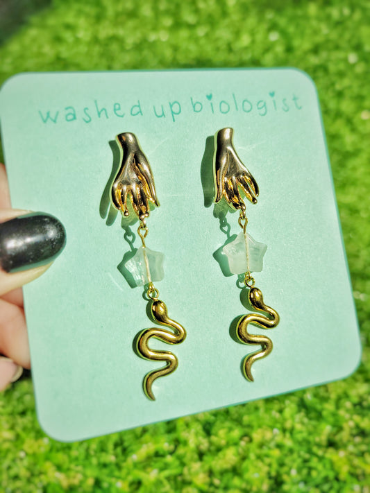 gold hand and snake earrings
