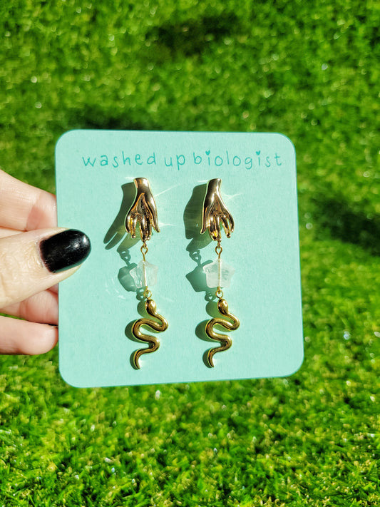 gold hand and snake earrings