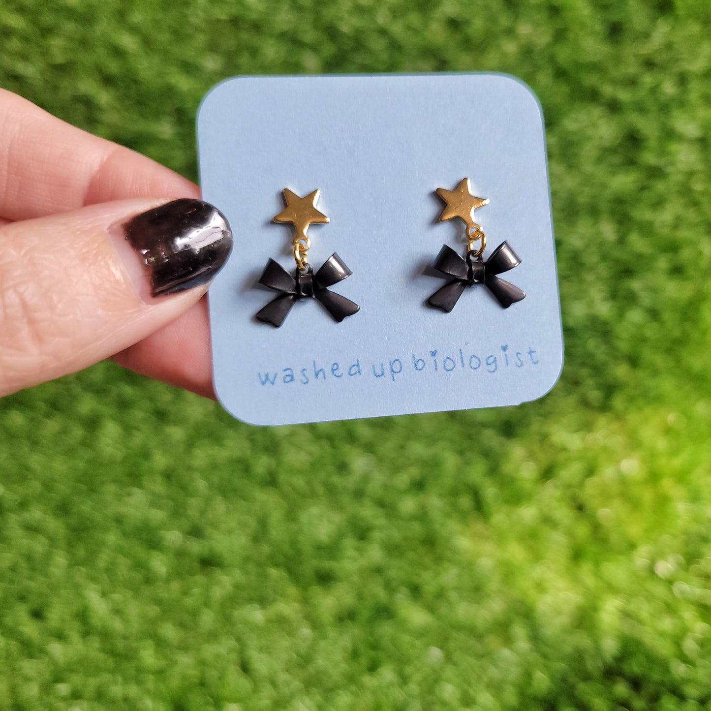 black bow dangly star stud earrings